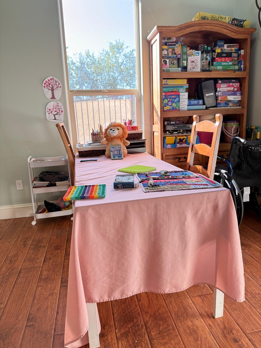 The activity table by the window, set up for crafts
