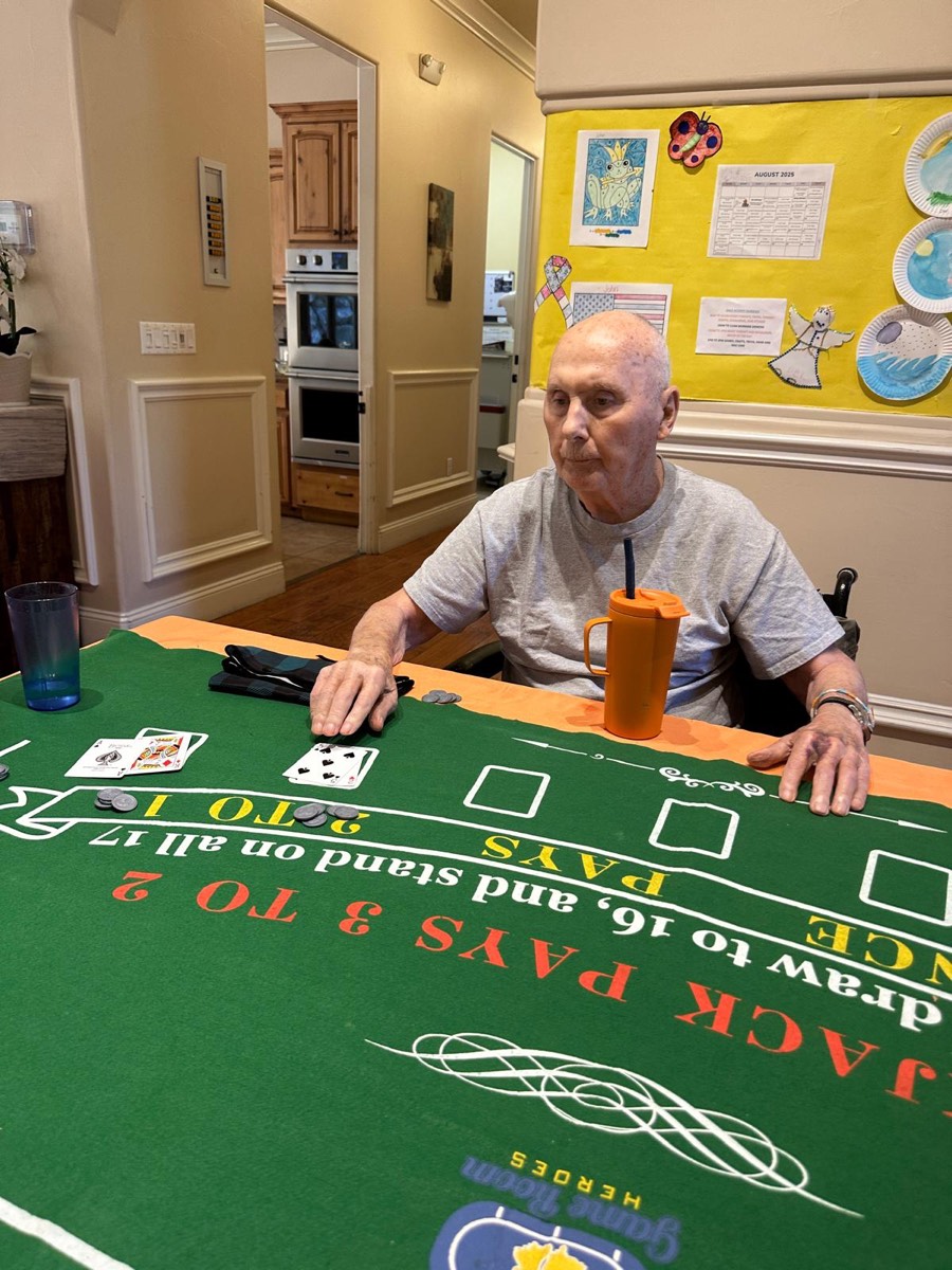 A resident playing a table game