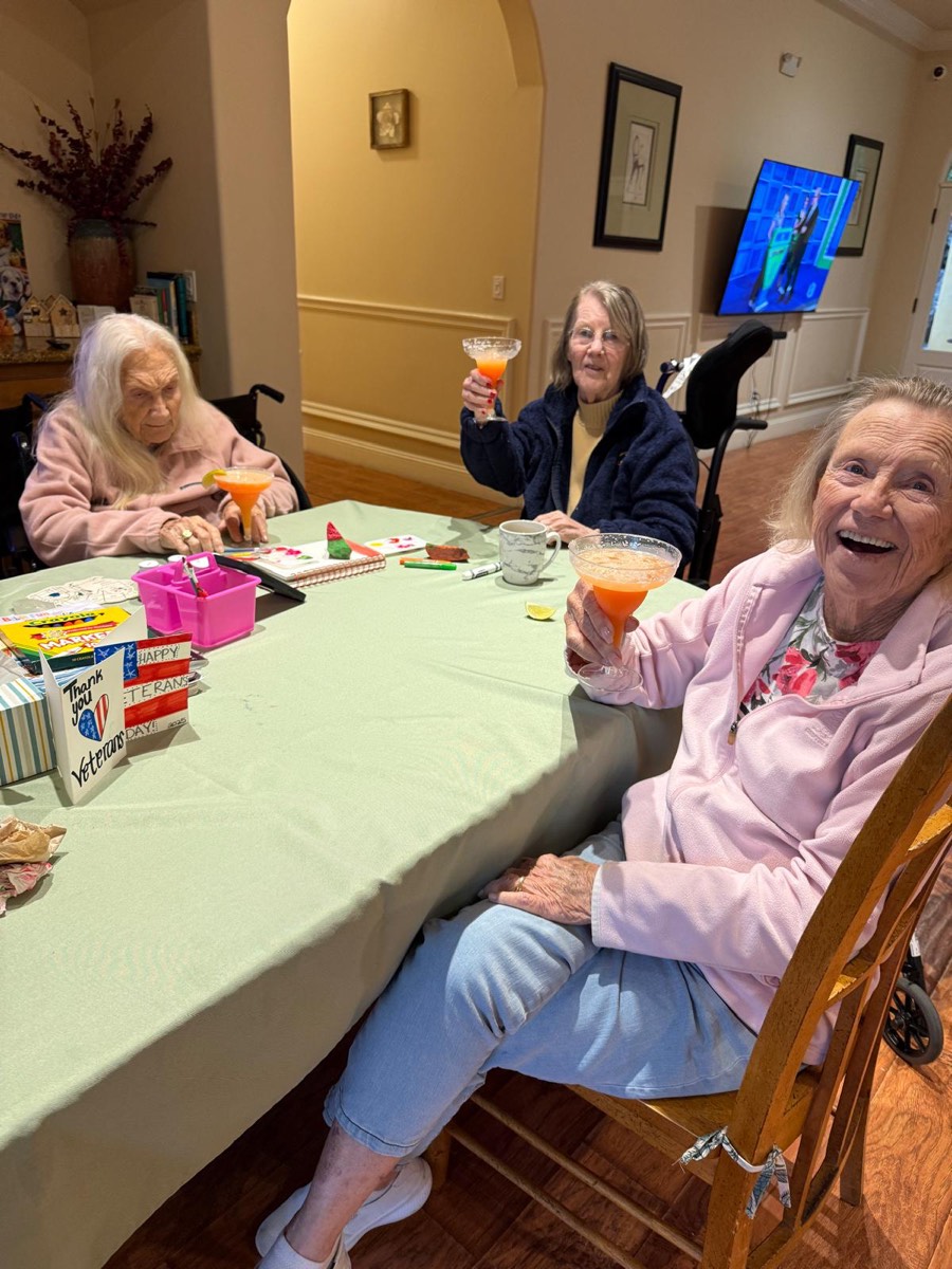 Two residents laughing together at the table